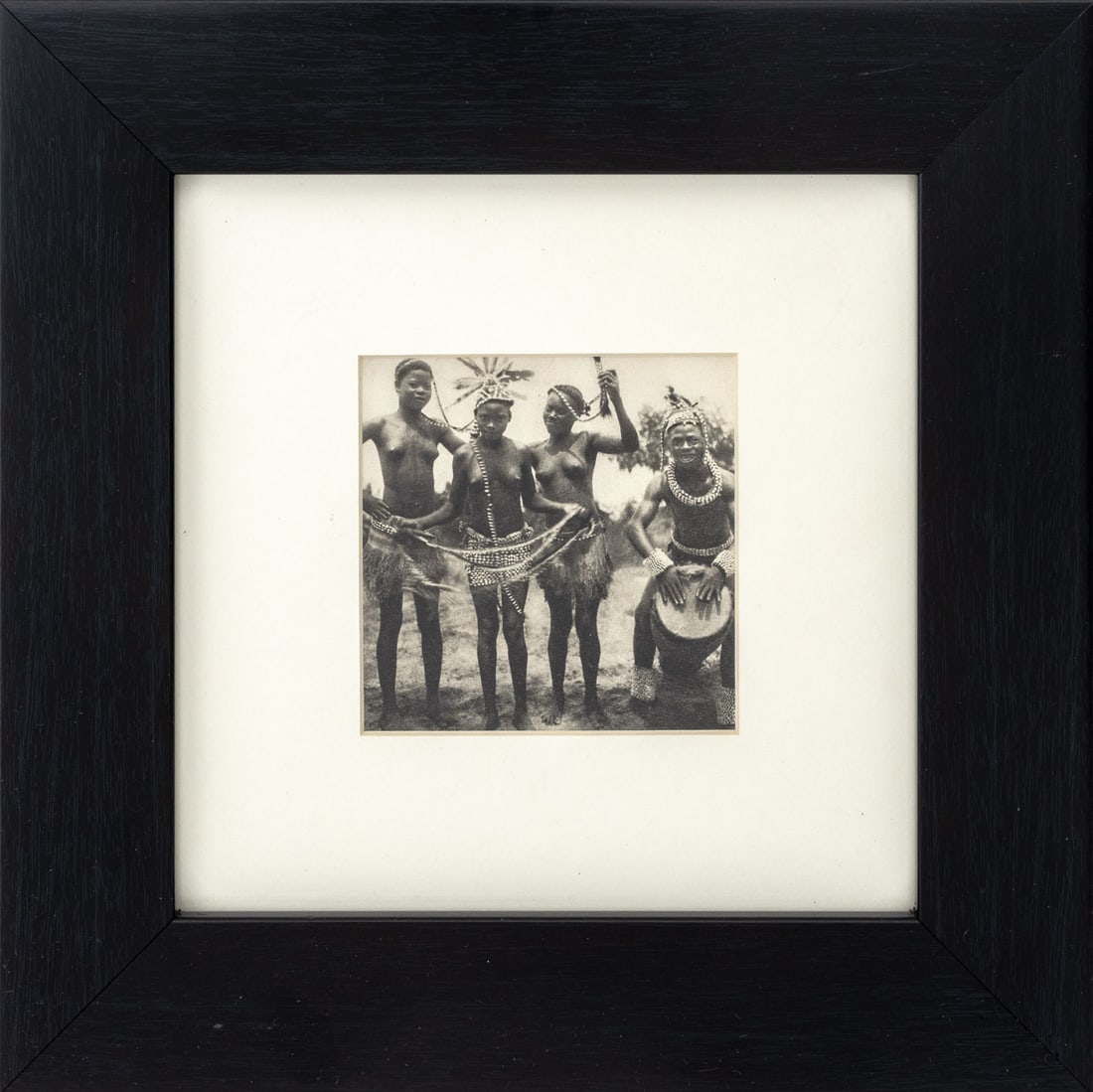 African Tribe Musicians Offset Lithograph: African Tribe Musicians, Offset Lithograph, ebonized wood frame. Image: 4" H x 4" W; frame: 11.25" H x 11.25" W x 1" D. Provenance: From a New Jersey Collection. Keywords: Photography, Prints, Multipl
