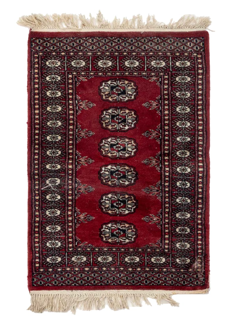 Pakistani Bokhara Rug, 3' 5" x 2' 1.5": Pakistani Bokhara Rug, with repeating geometric design on a red ground. 3' 5" L x 2' 1.5 W. Provenance: From a New York City Estate. Keywords: Small rugs, Carpets, Textiles, Floor covering, Hand-knott