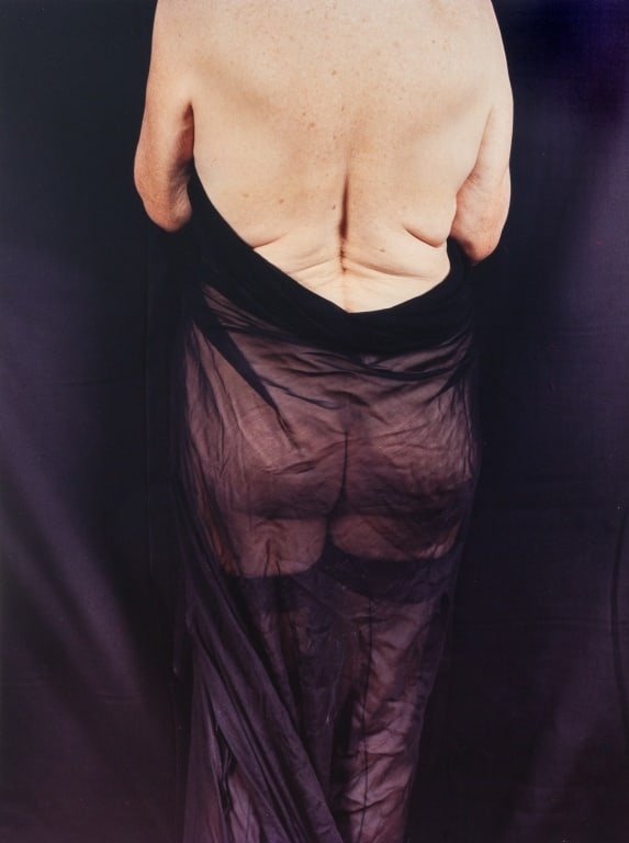 Anne Sager "Women Over 50" Chrmogenic Print: Anne Sager (American, 1930-2024), "Women Over 50" Series, Chromogenic Print in Colors on Kodak Paper, depicting a nude woman in sheer black drapery, with artist's estate stamp verso, unframed. 36.75"