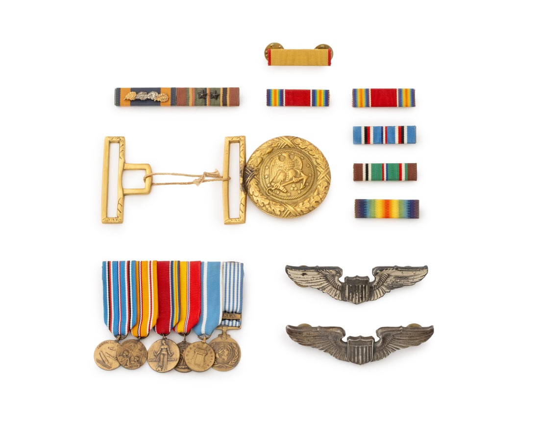 United States Military Medals, Ribbons & Pins, 11: Collection of Eleven United States Military Medals, Ribbons, and Pins, comprising: a gilt brass Model 1852 Navy officer's sword belt buckle, two silver Air Force pilot's wing badges, one marked "Sterl
