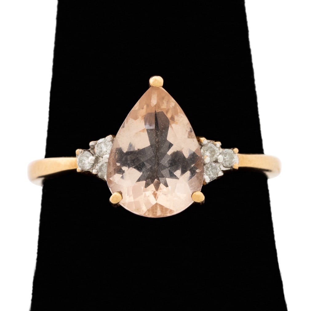 10K Rose Gold Pink Tourmaline Diamond Ring: 10K Rose Gold and Pink Tourmaline Diamond Ring, featuring one prong set pink tourmaline weighing approx. 1.85 carats, further adorned with six prong set round brilliant cut diamonds weighing a total o