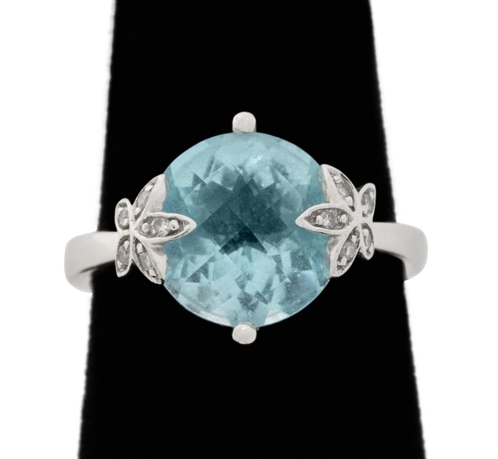 14K White Gold Blue Topaz Diamond Ring: 14K White Gold Blue Topaz Diamond Ring, featuring one centered prong set blue topaz weighing approx. 4.50 carats, further adorned with ten bead set single cut weighing a total of approx. 0.05 carat, m