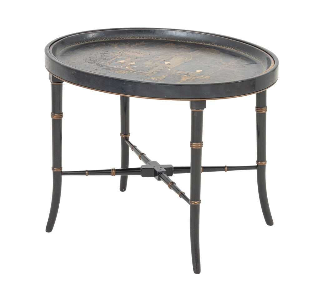 Chinoiserie Papier Mache Oval Tray Table: Chinoiserie Papier Mache Oval Tray Table, the oval top with painted and gilt figural courtyard scene above later faux bamboo legs conjoined by X-form stretcher. 19" H x 24.75" W x 19.25" D. Provenance