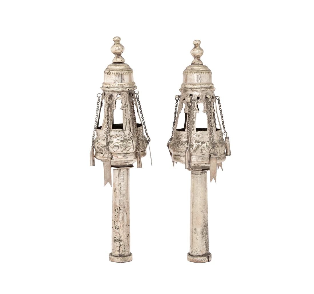 Judaica Silver Plate Torah Finials, Pair: Pair of Judaica Silver Plate Torah Finials, with pierced baluster body and hanging flags and bells. 11.75" H x 3" Diameter. Provenance: From a New York City Collection. Keywords: Jewish silver, Orname