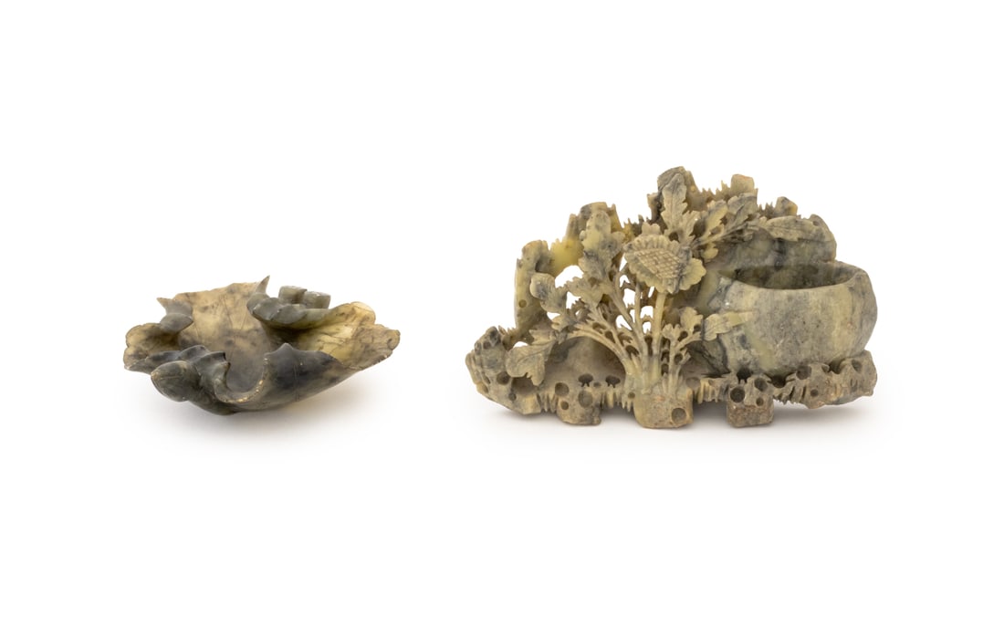 Chinese Carved Soapstone Vessels, 2: Two Chinese Carved Soapstone Vessels, comprising: garden scene brush pot and leaf form dish. Larger: 4.5" H x 7.25" W x 2" D. Provenance: From an East 74th Street Estate. Keywords: Chinese Art, China,