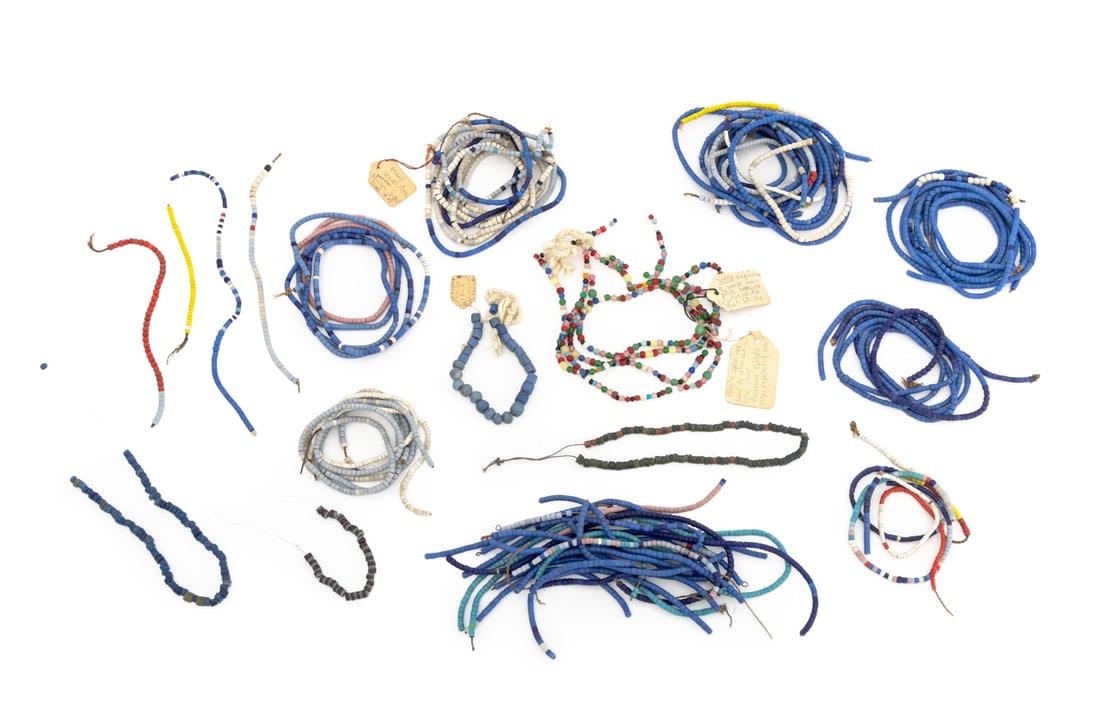 Collection of Venetian Glass African Trade Beads: Collection of Venetian Glass African Trade Beads, including: cobalt blue glass beads, red glass beads, and white glass beads. Largest bead: 1" L x 0.75" Diameter. Provenance: From the Estate of Jewelr