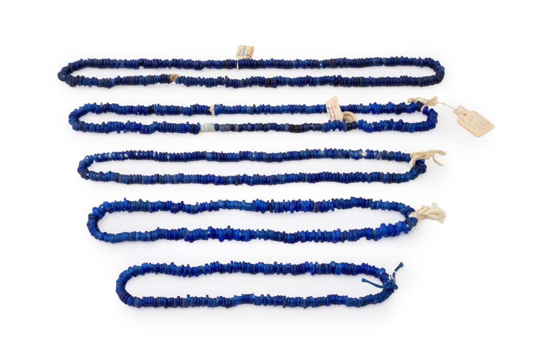 Cobalt Blue Glass African Trade Bead Stands, 5: Collection of Five Cobalt Blue "Dutch Donut" African Trade Bead Strands, one strand with three opaline glass beads. Longest: 38" L. Provenance: From the Estate of Jewelry Designer Irena Corwin. Keywor
