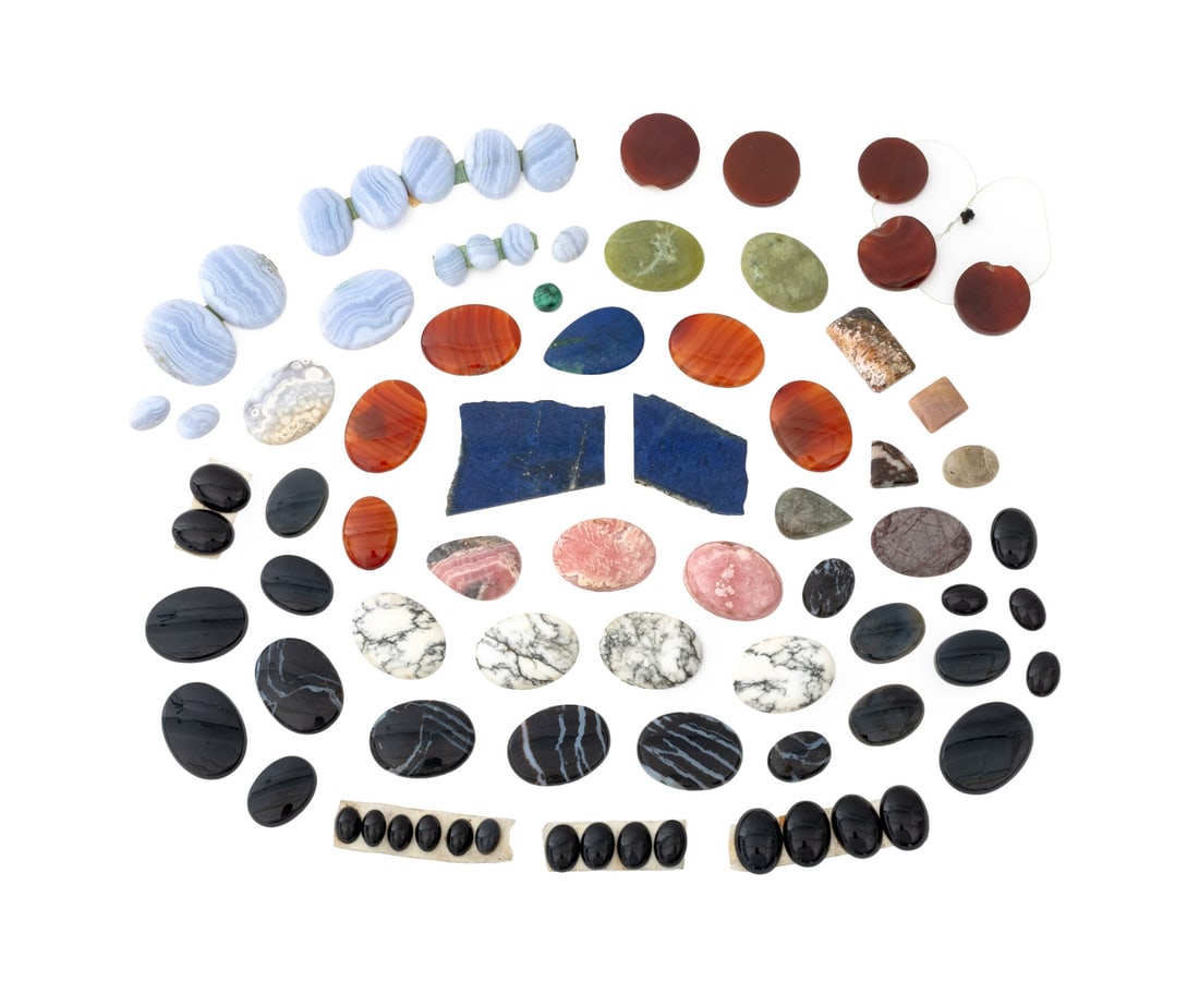 Collection of Crystal Cabochons, 79: Collection of 79 Crystal Cabochons, comprising: ten carnelian, three rhodochrosite, two quartz, 15 blue lace agate, one malachite, four jasper, four howlite, ten black agate, one azurite, two lapis la