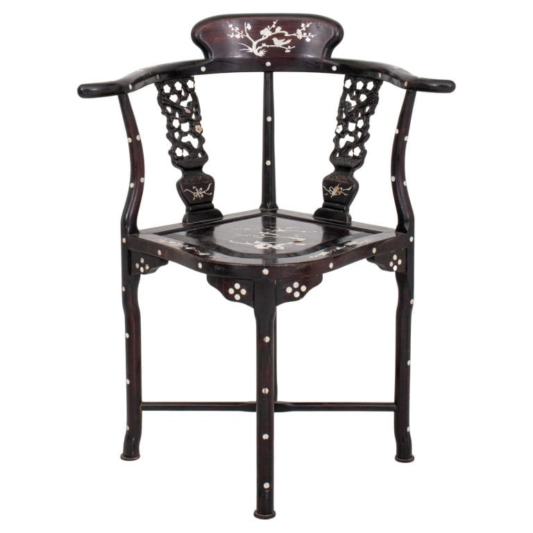 Chinese Export Mother-of-Pearl Inlaid Corner Chair: Chinese Export Mother-of-Pearl Inlaid Ebonized Corner Chair, the sweeping horseshoe-shaped crestrail centered by a prunus-inlaid rest, and supported by two reticulated and inlaid splats in the forms o