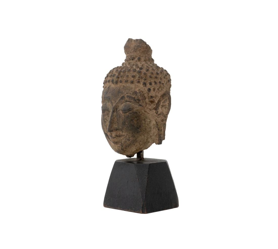 Thai Carved Stone Buddha Head Fragment: Thai Carved Stone Buddha Head Fragment, mounted atop an ebonized wood base. Overall: 4.5" H x 1.75" W x 1.75" D. Provenance: From an East 74th Street Estate. Keywords: Thailand, Southeast Asian Art, S
