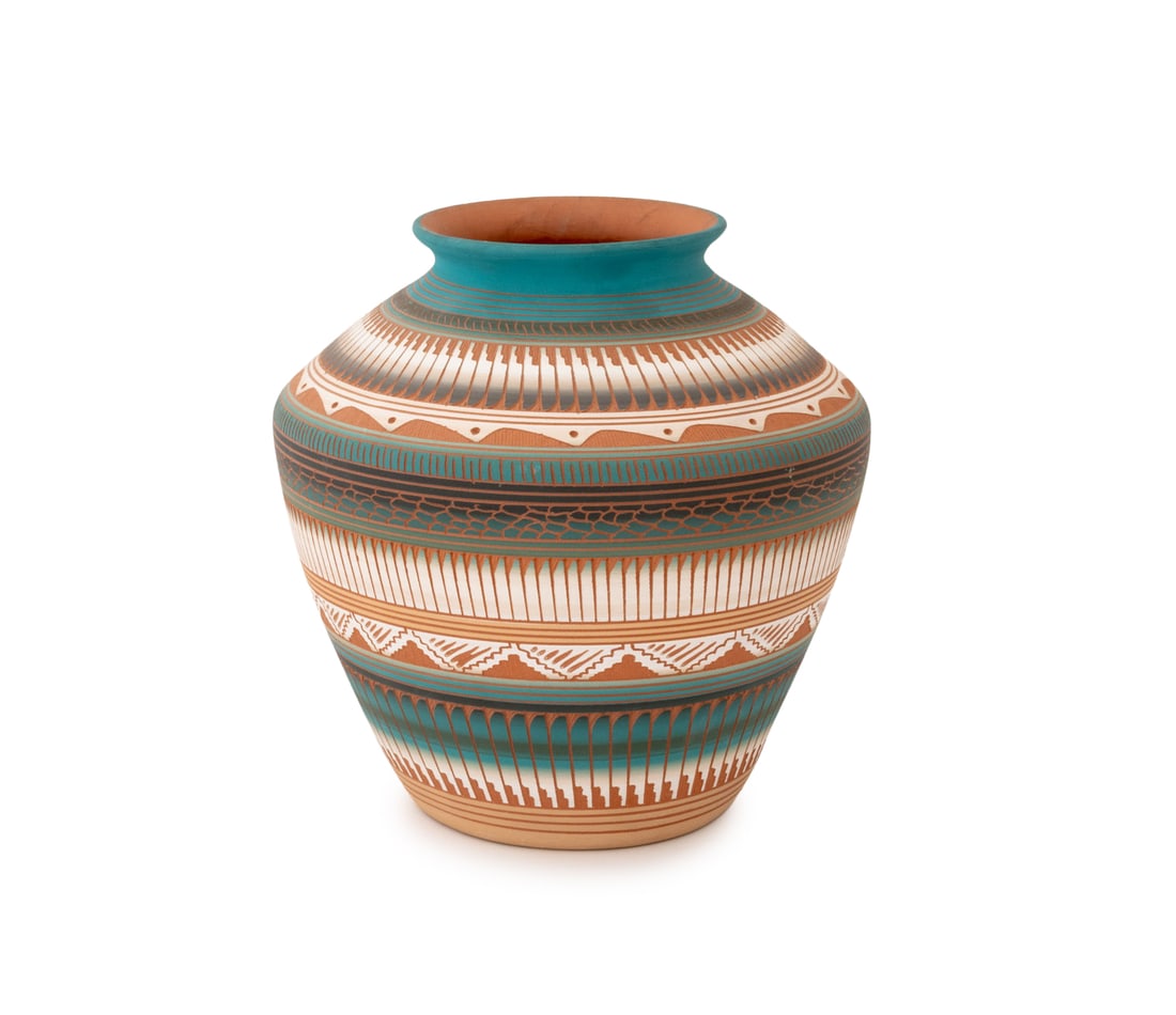 Susie Charlie Navajo Dine Pottery Vase: Susie Charlie (Navajo Dine, XX-XXI) Pottery Vase, signed with incised pictorial landscape scene to underside, with etched geometric feather motif. 7.75" H x 7" Diameter. Provenance: From an 135 East