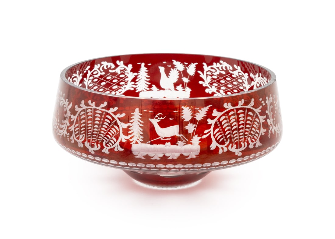 Bohemian Ruby Red Cut Glass Bowl: Bohemian Ruby Red Cut to Clear Glass Bowl, with forest and animal scenes. 4.5" H x 9.5" Diameter. Provenance: From an East 74th Street Estate. Keywords: Glassware, Tableware, Dining, Centerpiece bowl,