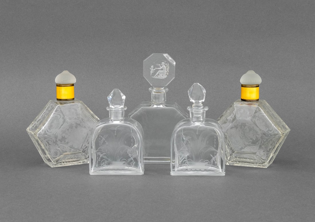 French Etched Glass Perfume Bottles, 5: Collection of Five French Etched Glass Perfume Bottles, comprising: pair of hexagonal bottle with yellow enamel ferrule and mushroom form stopper, unmarked, pair with bird etched motif and diamond for
