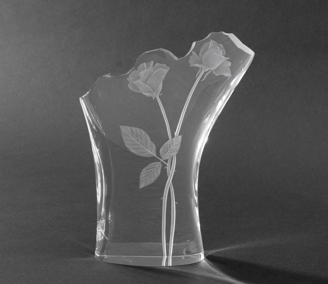 Steuben "Rose Bouquet" Glass Sculpture, 1995: Steuben "Rose Bouquet" Glass Sculpture, 1995, designed by David Dowler, marked "Steuben" to underside. 8.75" H x 6.25" W x 1.75" D. Provenance: From a Long Island Estate. Keywords: Art Glass,