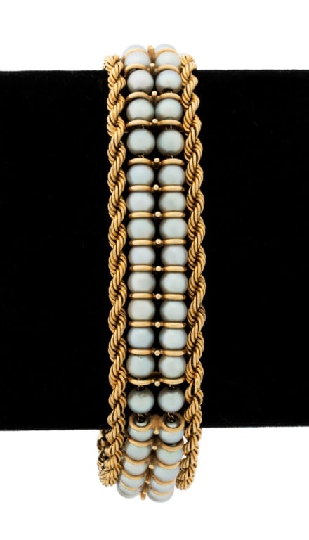 14K Yellow Gold Cultured Pearl Bracelet: 14K Yellow Gold Cultured Pearl Bracelet, brightly polished, featuring two strands of fully drilled cultured pearls strung on gold chain with gold spacers between each group of two pearls, approx. 4.5