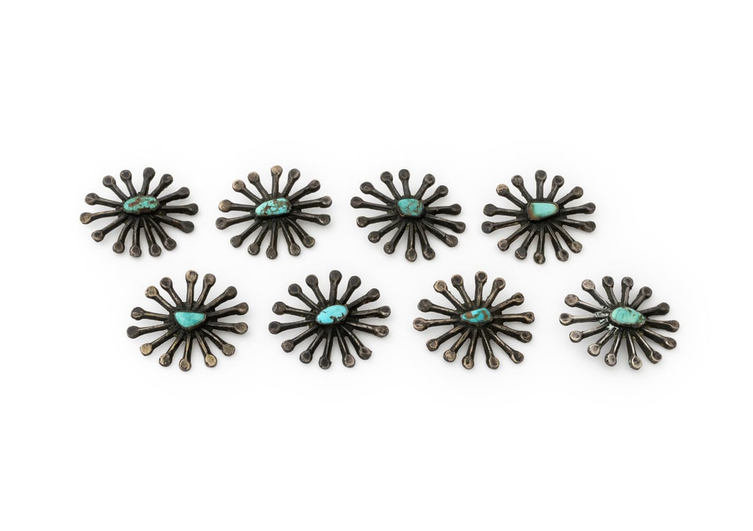 Navajo Dine Turquoise Silver Sunburst Buttons, 8: Set of Eight Navajo Dine Turquoise and Silver Sunburst Form Buttons, each with fourteen stylized rays centering a blue turquoise cabochon. Silver tested. Weight: 5.14 ozt. inclusive; 1.5" Diameter. Pr