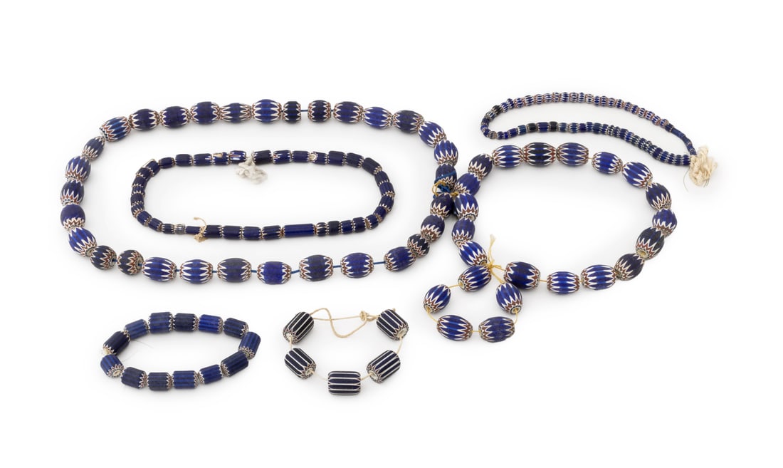 Venetian Glass African Trade Bead Strands, 5: Collection of Five Venetian Chevron Six Layer Glass African Trade Bead Strands. Largest bead: 1.5" L x 1" Diameter. Provenance: From the Estate of Jewelry Designer Irena Corwin. Keywords: Rosetta patt