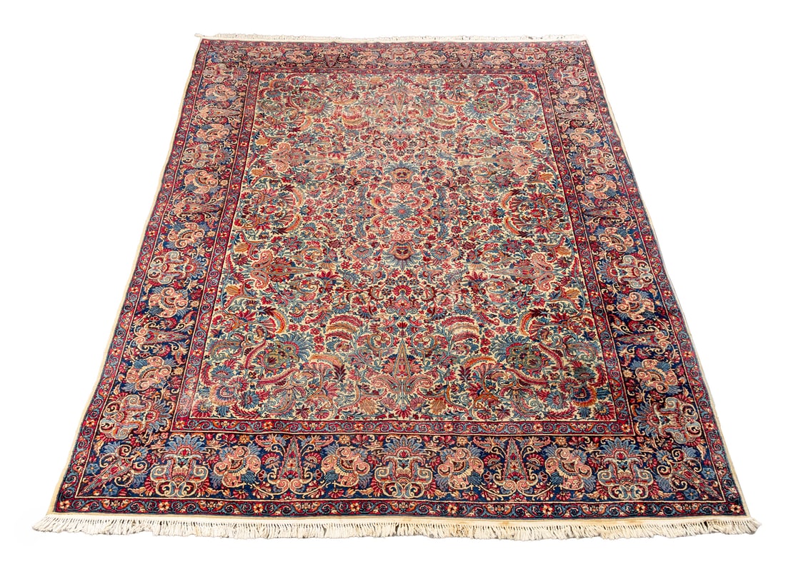 Persian Lavar Kerman Wool Carpet, 12' 5" x 8' 11": Persian Lavar Kerman Wool Carpet, pink and navy ground with floral motif. 12' 5" L x 8' 11" W. Provenance: From a New York City Collection. Keywords: Persian Rugs, Area rug, Floor covering, Textile,