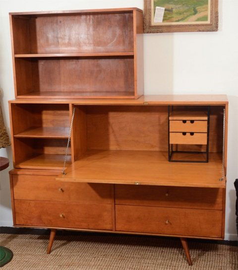 Mid Century American Paul McCobb Wall Unit: A vintage secretary by Paul McCobb for Wichendon Planner Group. The item consists of three stacked components; a lower credenza with four drawers, a secretary desk with fold down writing surface and i