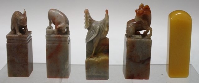 Lot of 5 Chinese Animal & Yellow Soapstone Seals: A set of four soapstone seals topped with carved animals and one smooth yellow soapstone, China; animal seals are marked. Dimensions: Yellow soapstone 3" H x 7/8" L x 7/8" W Ram 3-1/4" H x 1" W x 1" L