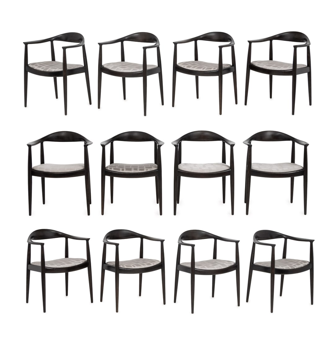 Hans J. Wegner x Hansen "The Chair" Armchairs, 12: Hans J. Wegner (Danish, 1914-2007) for Johannes Hansen Set of 12 "The Chair" Teak Arm Chairs, with gray upholstered seats, marked "Johannes Hansen Copenhagen Denmark". 30" H x 24" W x 17" D; seat: