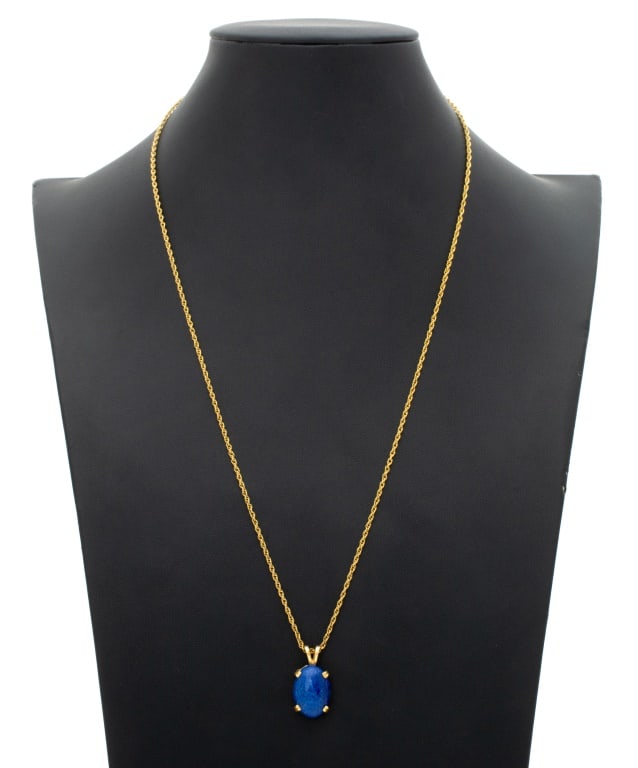 14K Yellow Gold Lapis Lazuli Pendant Necklace: 14K Yellow Gold Lapis Lazuli Pendant Necklace, featuring one oval lapis cabochon weighing approx. 13.00 carats, detachable from 14k yellow gold rope chain necklace joined with spring ring clasp,
