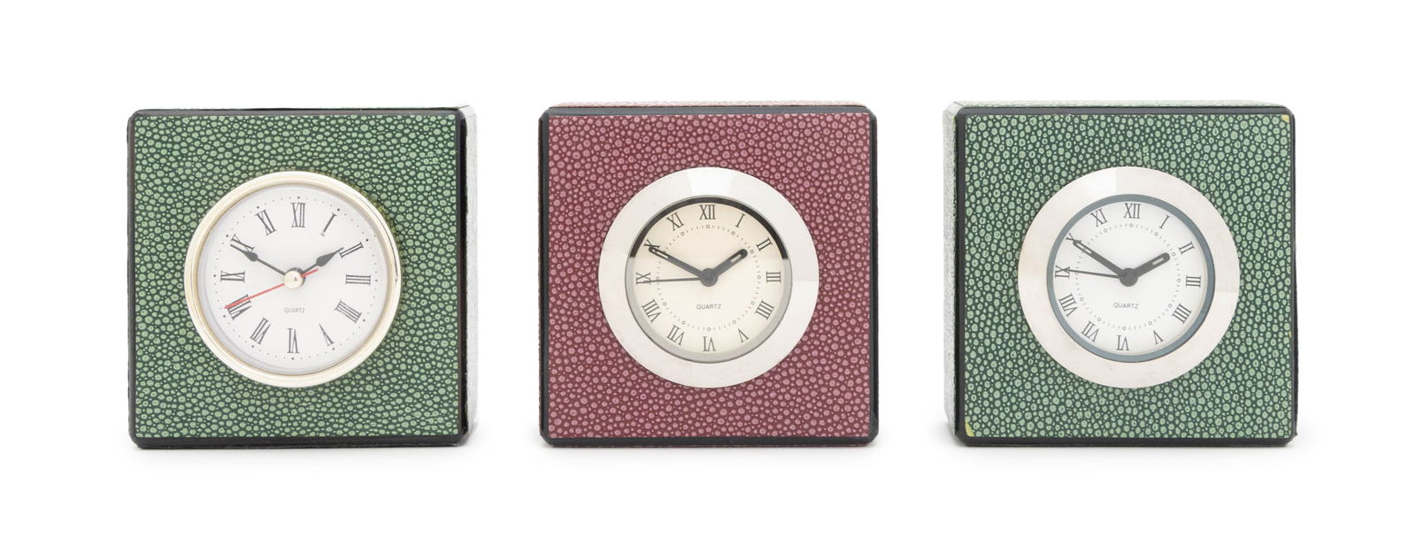 Contemporary Faux Shagreen Desk Clocks, 3: Group of Three Contemporary Faux Shagreen Desk Clocks, with Roman numeral indices and quartz movements, one cranberry red and two forest green. Each: 4" H x 4" W x 2" D. Provenance: From a Connecticut
