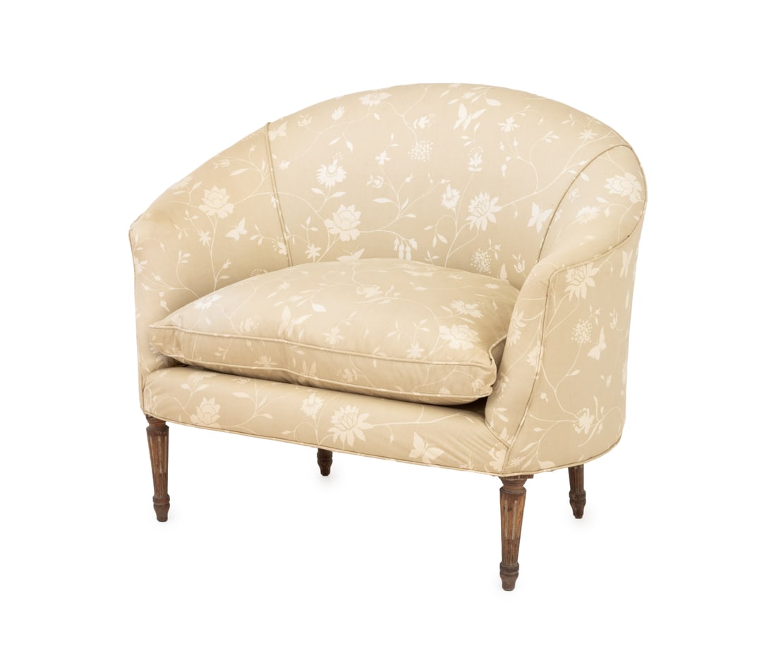 Brunschwig & Fils Upholstered Lounge Chair: Brunschwig et Fils Upholstered Lounge Chair, butterfly and flowers pattern beige upholstery on tapered fluted wood legs. 38" H x 46" W x 29" D; seat: 21" H. Provenance: From a Connecticut Estate. Keyw