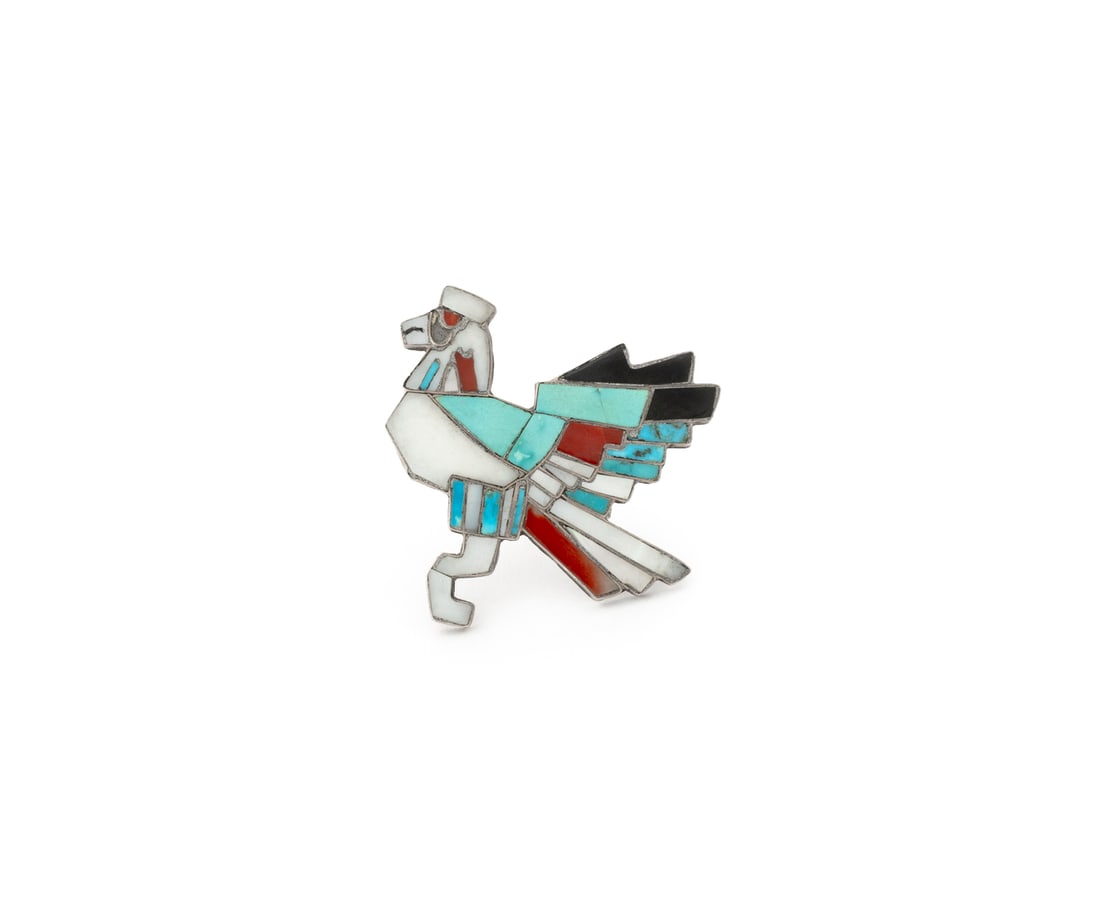 Zuni Sterling Silver Inlay Eagle Dancer Brooch: Zuni Sterling Silver Inlay Eagle Dancer Brooch, designed as sterling silver with inlaid chalcedony, coral, mother-of-pearl, onyx, and turquoise, depicting the Native American deity known to bring mess