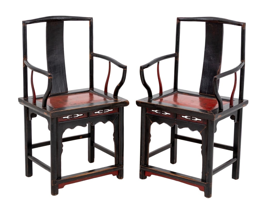 Chinese Black Lacquered Armchairs, ca. 1900, Pair: Pair of Chinese Black Lacquered Armchairs, circa 1900, each with red painted seat and carved apron conjoined by box stretcher. 41" H x 22.25" W x 17.25" D; seat: 17" H. Provenance: From a West 12th St