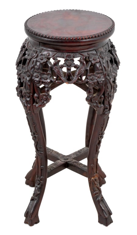 Chinese Carved Hardwood Pedestal Table: Chinese Carved Hardwood Pedestal Table, late 19th century, the circular top above a pierced foliate carved frieze, on scrolled legs joined by an X-form stretcher. 25" H x 13" W x 13" D. Keywords: Asia