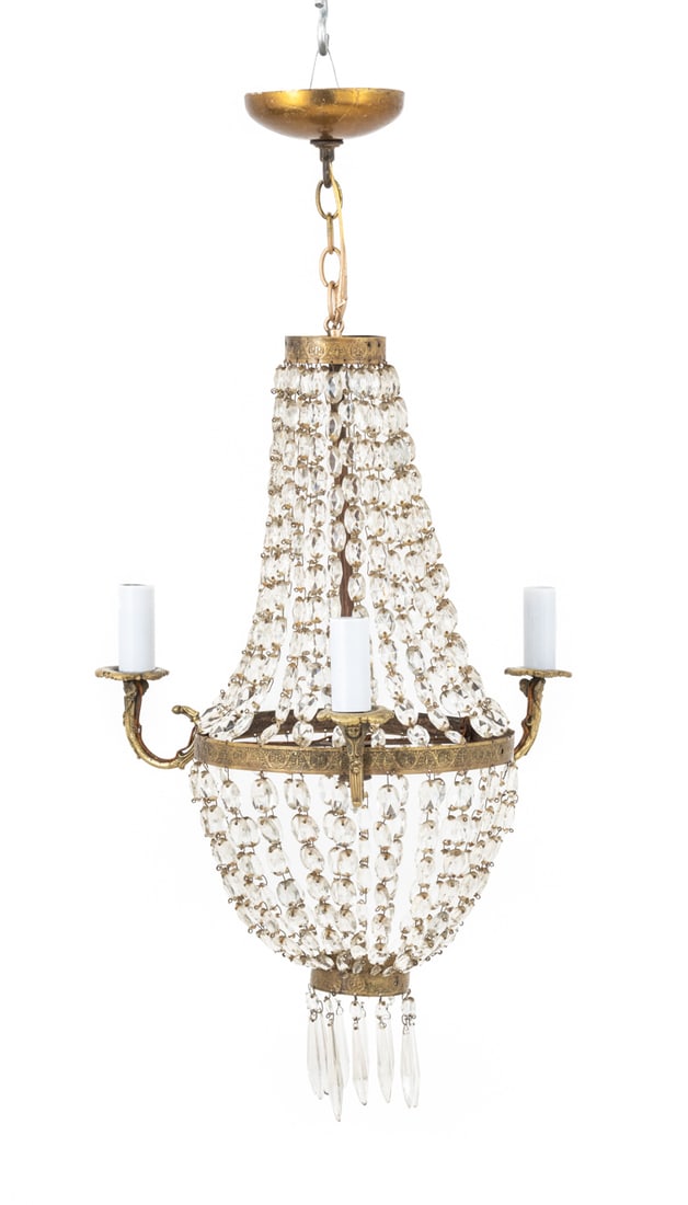 French Empire Cut Crystal and Brass Chandelier: French Empire Cut Crystal and Brass Three Light Chandelier, with waterfall drop crystal pendants. 36" H x 17.5" Diameter. Provenance: From an Upper West Side, New York City Estate. Keywords: Crystal c