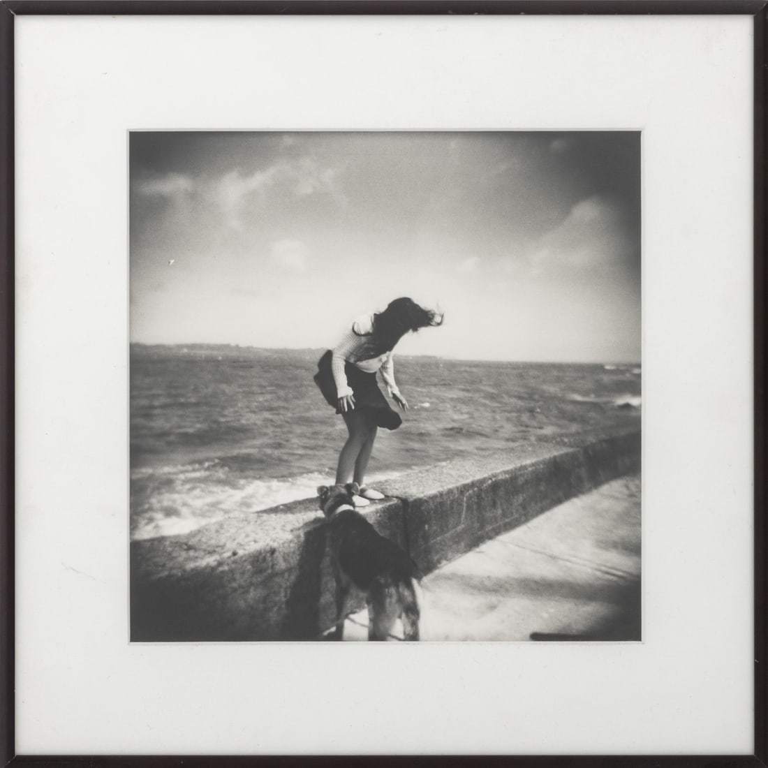 Brigitte Grignet "Girl Jumping ..." Silver Print: Brigitte Grignet (Belgian, b. 1968), "Girl Jumping off Sea Wall", Gelatin Silver Print, 2006, signed, dated, and inscribed "For Joan, happy Birthday! / Love, love, love!" to verso, black metal frame.