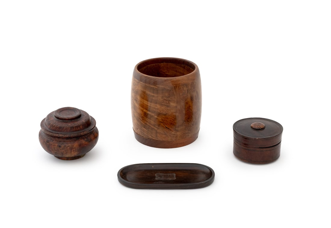 Turned and Carved Wood Accessories, 4: Group of Four Carved and Turned Wood Accessories, comprising: maple burl wood cup, signed "M.C. Isaac" to underside, two small covered circular boxes, one burl wood and one walnut, and one Howard Turt