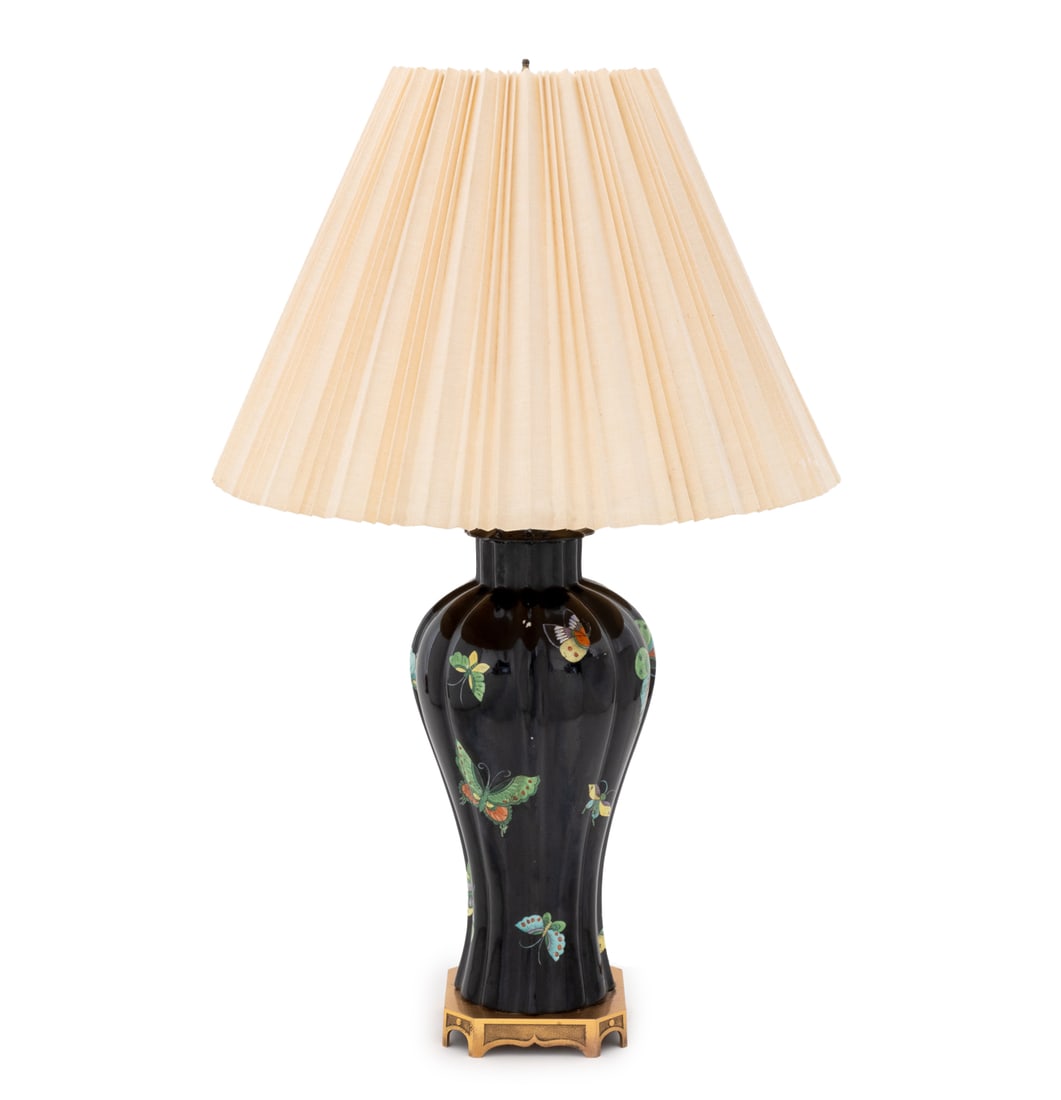 Chinese Famille Noir Porcelain Vase Mounted Lamp: Chinese Famille Noir Porcelain Vase Mounted as a Table Lamp, the reeded meiping with polychrome butterfly motif and mounted on a square gilt metal base, with pleated linen shade. Overall: 31.5" H x 19