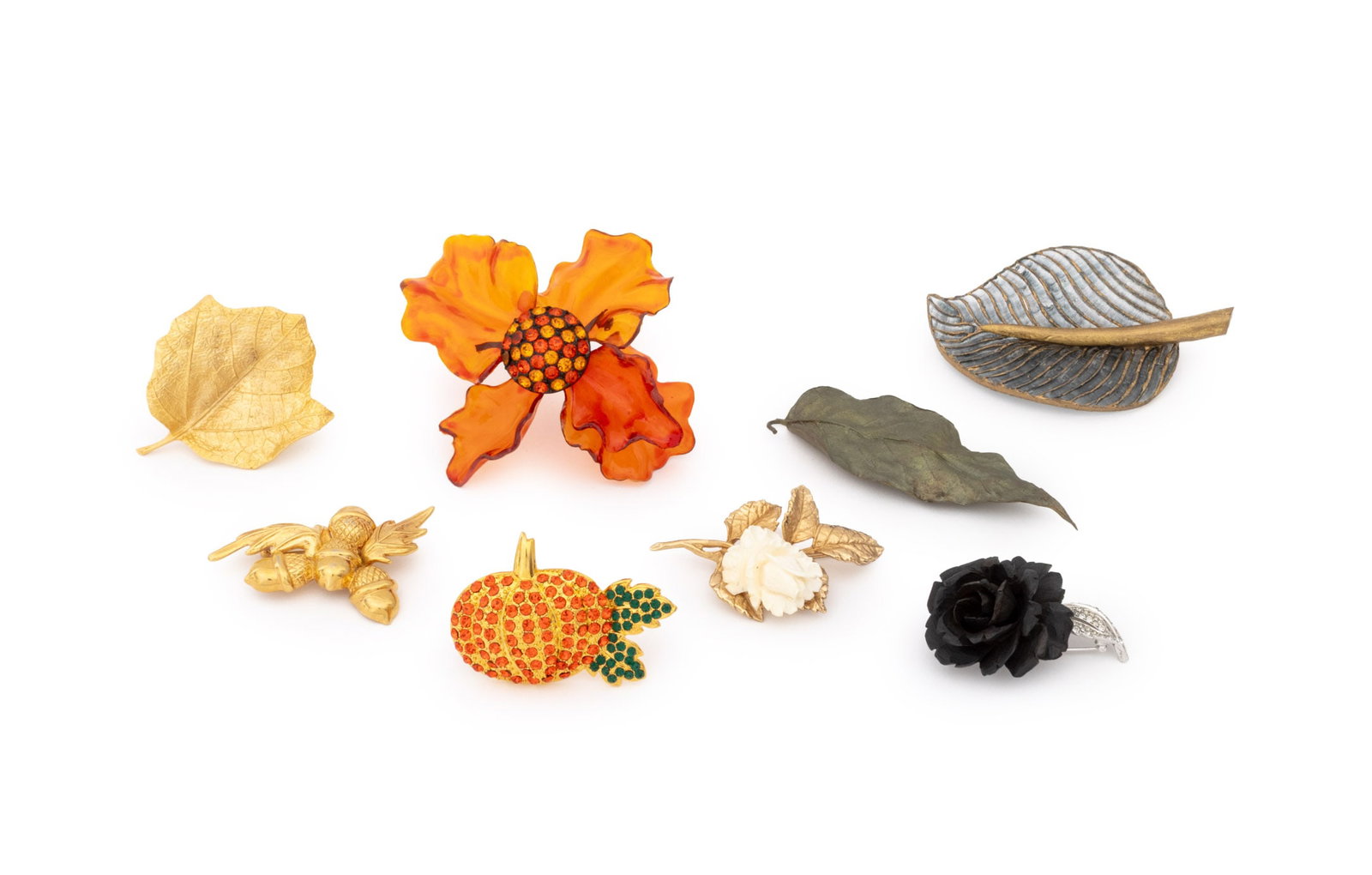 Foliate, Fruit, and Flower Form Brooches, 8: Collection of Eight Foliate, Fruit, and Flower Form Brooches, comprising: a Boucher carved wood rose form brooch, a Monet acorn cluster, a Fabrice leaf form, a gem-set orange plastic floriform brooch,