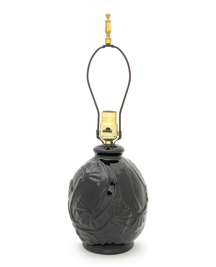 Modern Black Glazed Ceramic Table Lamp: Modern Black Glazed Ceramic Table Lamp, with embossed flowers. 19.25" H x 7.25" Diameter. Provenance: From a Connecticut Estate. Keywords: Lighting, Pottery, Accent lamp, Floral motif, Interior