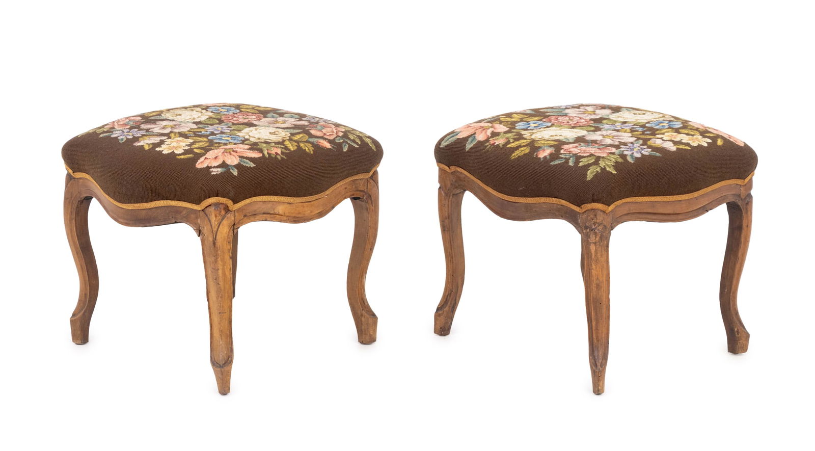 Victorian Floral Needlepoint Walnut Footstools, 2: Pair of Victorian Floral Needlepoint Upholstered Walnut Footstools. 20" W x 19.5" D. Provenance: From a Connecticut Estate. Keywords: Antique Furniture, Needlework, Seating, Foot rest, Ottoman, Interi