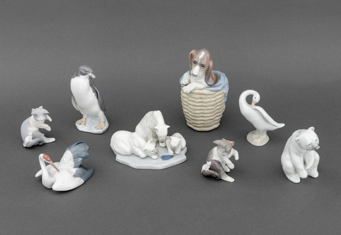 Lladro Porcelain Animal Figurines, 8: Collection of Eight Lladro Porcelain Animal Figurines, comprising: puppy in a basket, polar bear family, (1) one polar bear, (2) kitten and mouse, one unglazed, duck, penguin, and swan, each marked to