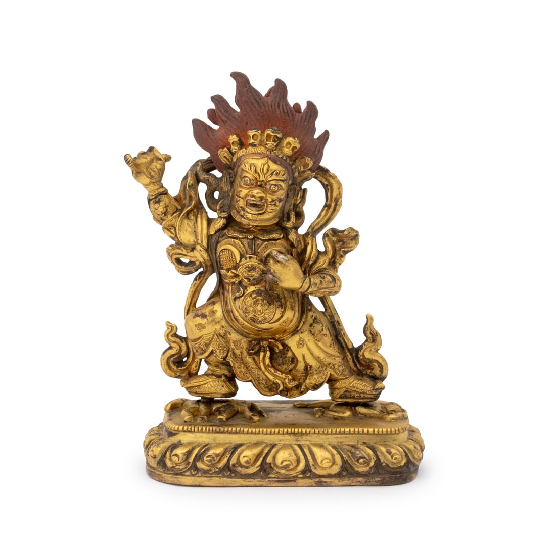 Chinese Tibetan Vajrapani Gilt Bronze Sculpture: Chinese Tibetan Vajrapani Gilt Bronze Sculpture, 19th century or earlier, the deity with remnants of original pigment and crushing an animal and human figure and fitted into a lotus form pedestal. Ove