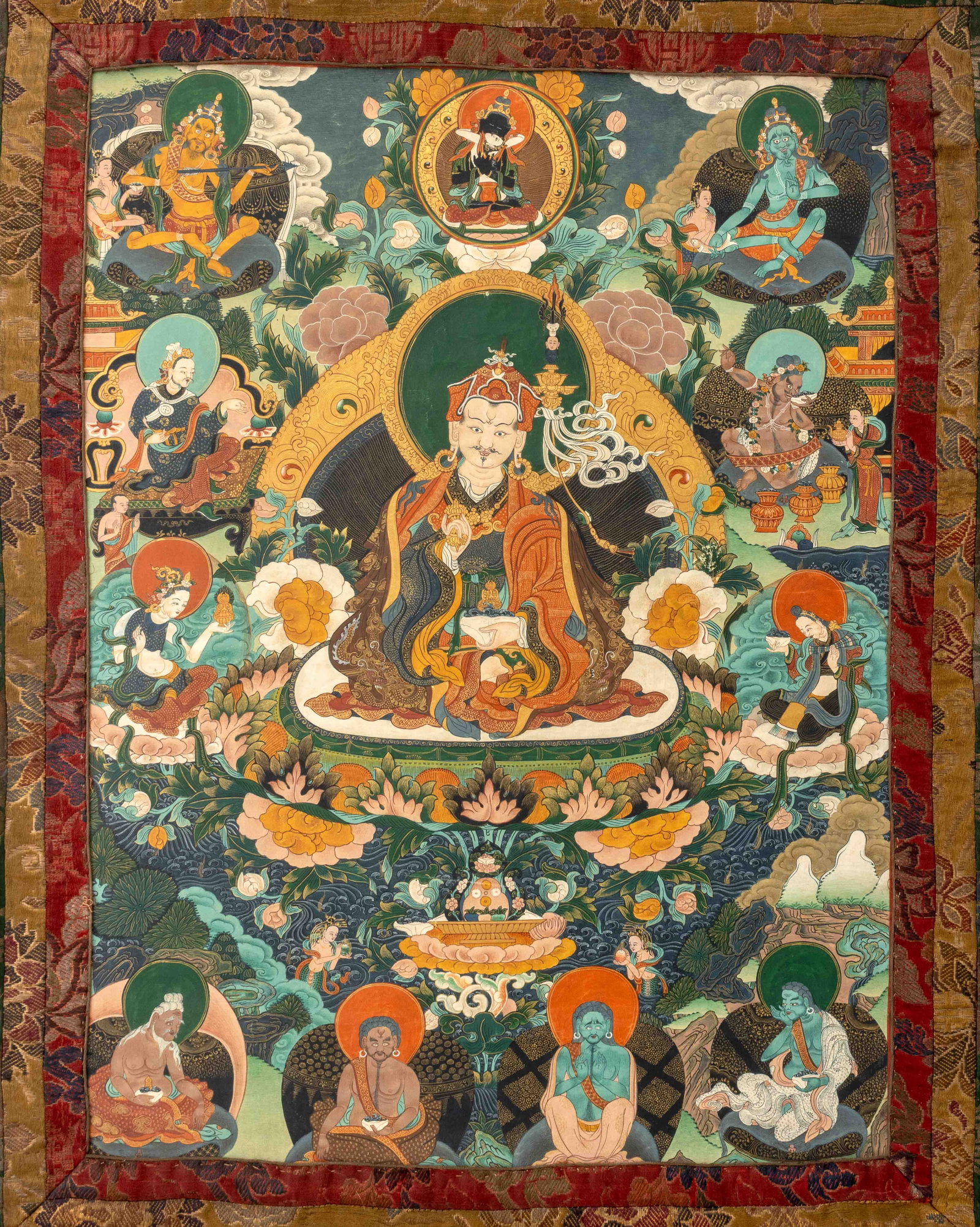 Tibetan Padmasambhava Thangka Gouache, 19th C.: Tibetan Padmasambhava Thangka, Gouache on Paper, 19th century, mounted on early 20th century silk, depicting Padmasambhava surrounded by female guardians. Image: 24.5" H x 18" W; overall: 40.5" H x 28