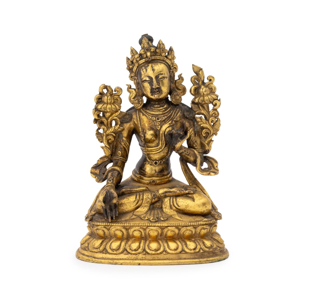 Chinese Tibetan White Tara Gilt Bronze Sculpture: Chinese Tibetan White Tara Gilt Bronze Sculpture, 18th century or earlier, her hair with remnants of original pigment, the Mother of All Buddhas flanked by lotus flowers and seated atop a double lotus