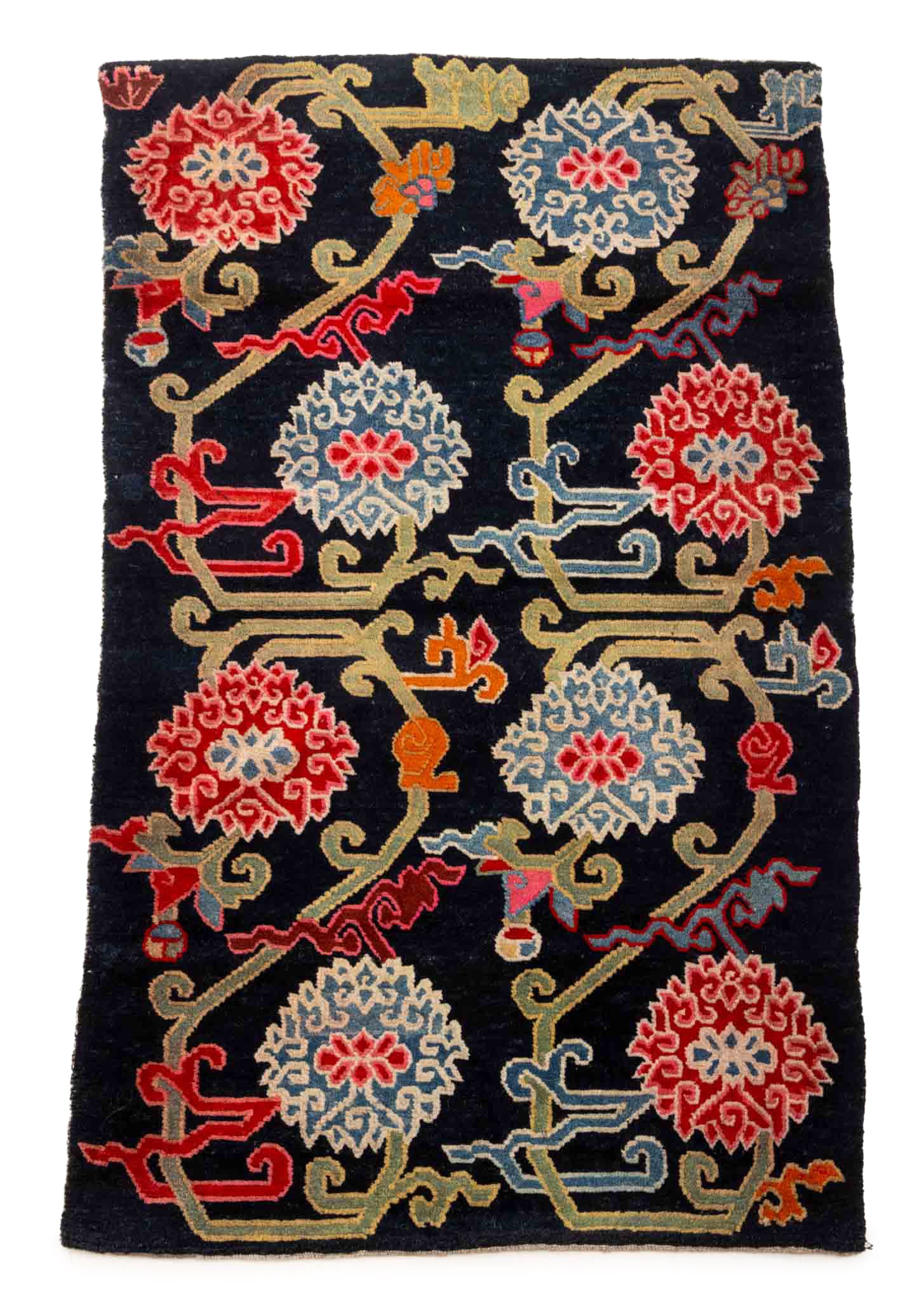 Tibetan Lotus Flower Khaden Rug, 4' 7.5" x 2' 9.5": Tibetan Lotus Flower Motif Khaden Wool Rug, with eight flowers on a dark ground. 4' 7.5" L x 2' 9.5" W. Provenance: From the Estate of Joseph Lawrence Gardella. Keywords: Pema Chunyi Style, Himalayan