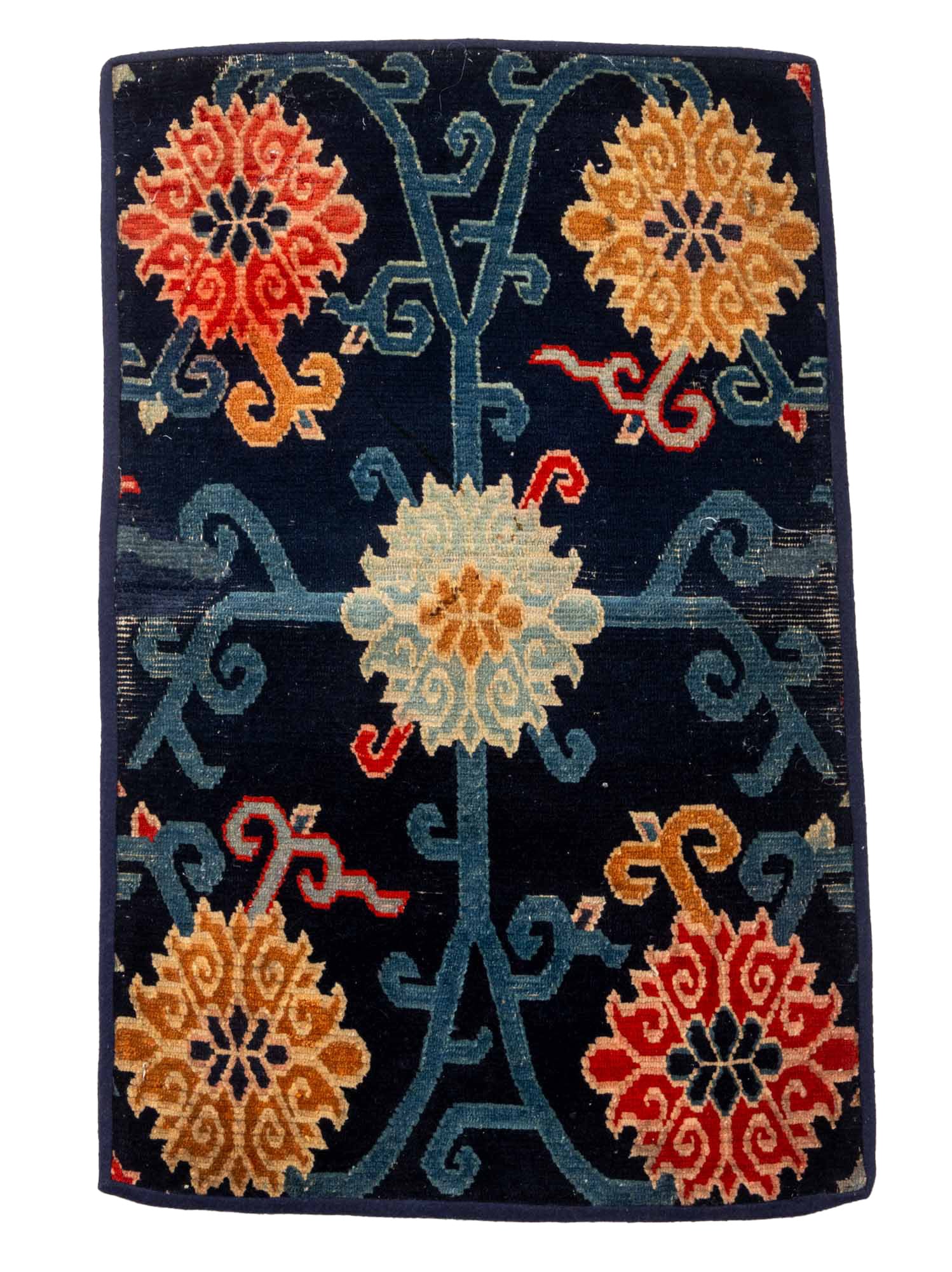 Tibetan Lotus Flower Khaden Rug, 2' 7.5" x 1' 8": Tibetan Lotus Flower Motif Khaden Wool Rug, on a navy blue ground. 2' 7.5" L x 1' 8" W. Provenance: From the Estate of Joseph Lawrence Gardella. Keywords: Himalayan Art, Nepal, Asian Art, Textiles, Pe