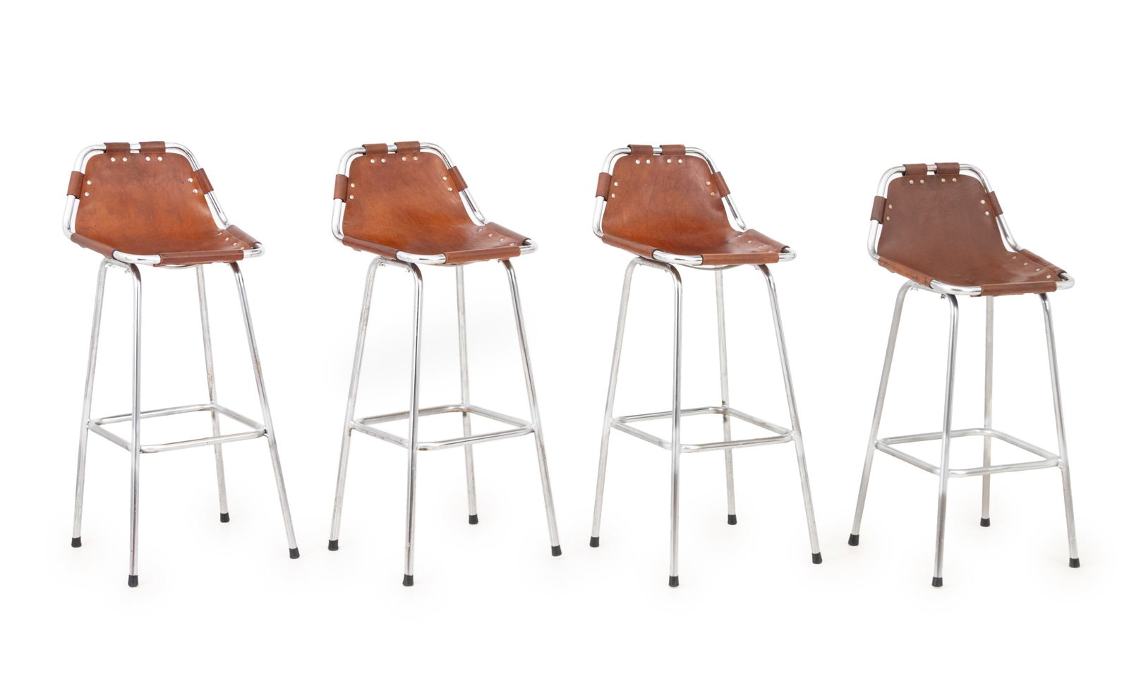 Charlotte Perriand "Les Arcs" Bar Stools, 4: Charlotte Perriand (French, 1903-1999) Set of Four "Les Arcs" Bar Stools, brown leather seats on chrome-plated frames, one shorter. Taller: 37.5" H x 16.5" W x 16" D; seat: 29.5" H. Provenance: From a