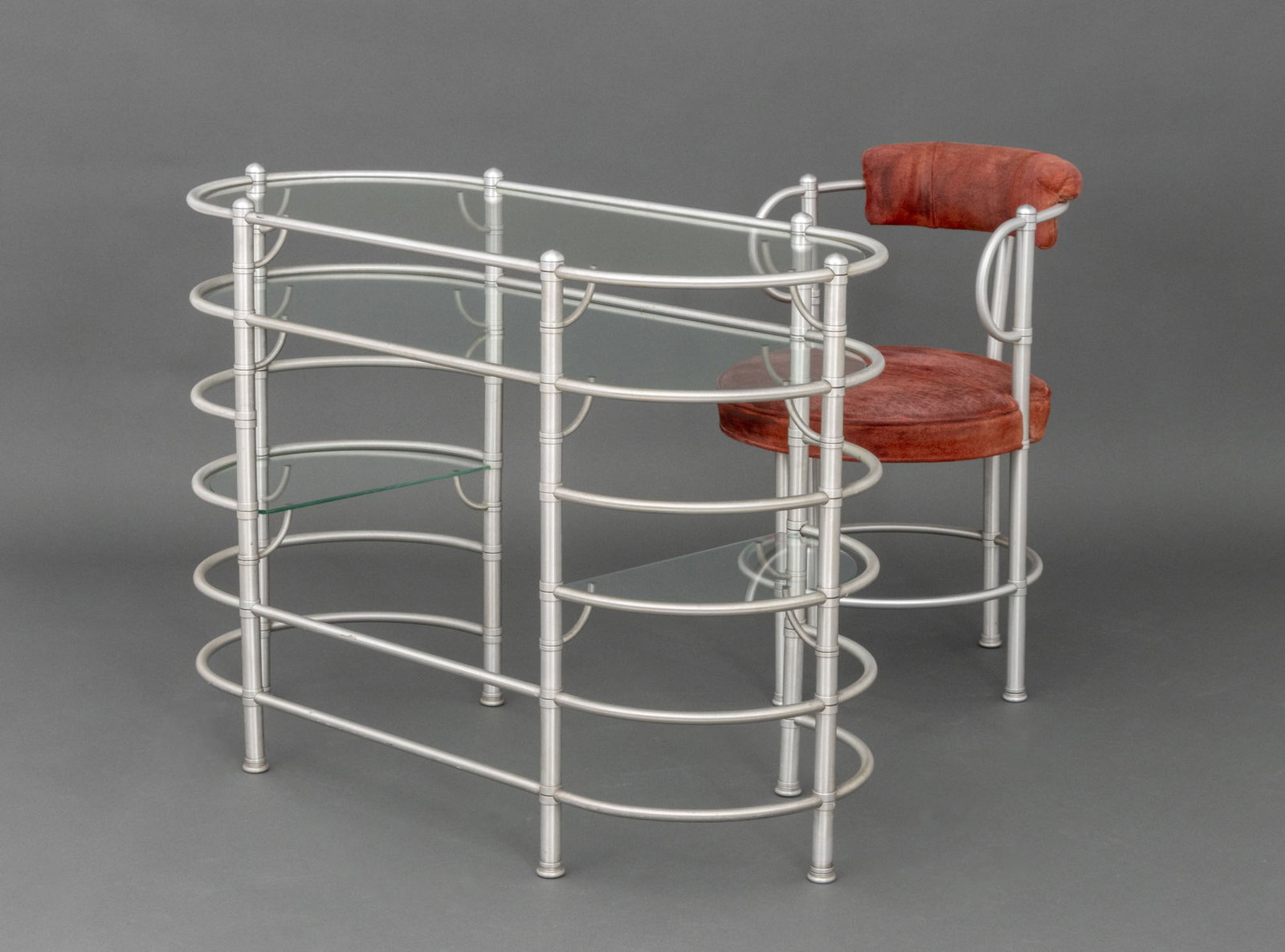 Warren McArthur Art Deco Vanity & Chair: Warren McArthur (American, 1885-1961) Art Deco Vanity and Chair, aluminum, suede upholstery, and glass, the chair with firm's label "WARREN MCARTHUR CORPORATION MANUFACTURERS, ROME, NY, ANODIC FURNITU