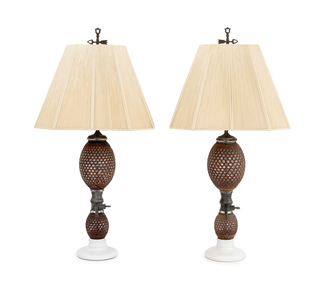 French Briet Brevete Seltzer Bottle Table Lamps, 2: Pair of French Briet Brevete Seltzer Bottle Table Lamps, 19th century, glass globes wrapped in rattan mounted on circular porcelain bases, marked "Gazogene Briet" to the dispenser. Overall: 36" H x 18