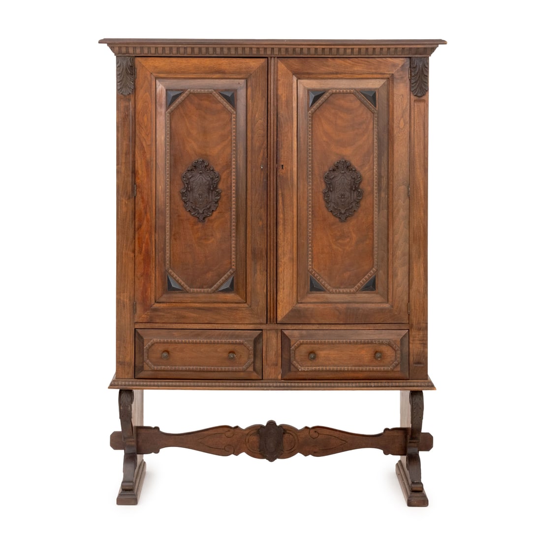 Renaissance Revival Walnut Linen Press: Renaissance Revival Walnut Linen Press, the two doors with carved crest opening to two shelves and hooks above two drawers on scroll feet conjoined by central stretcher, marked "B & Co. No. 100" to re
