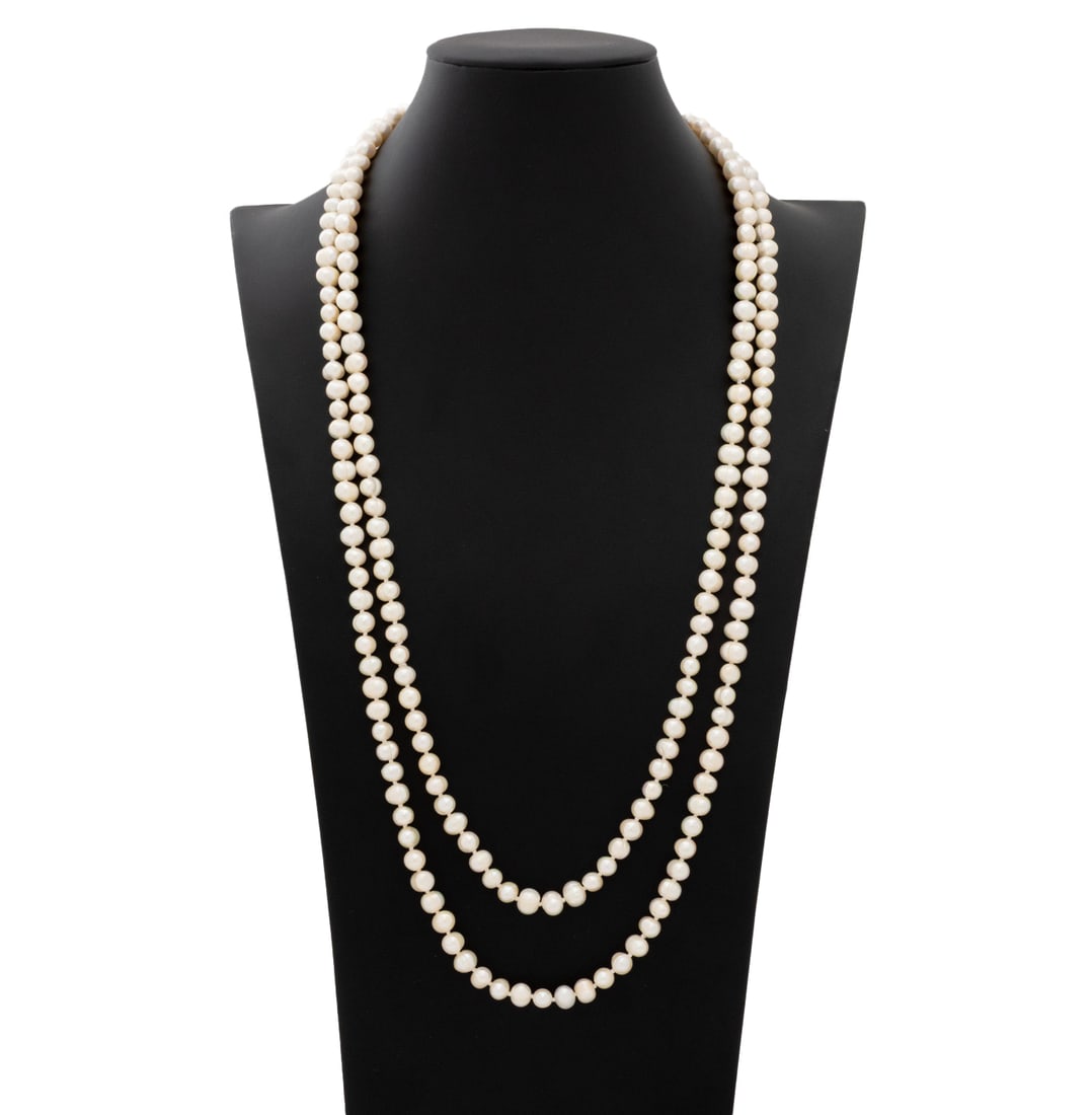 Cultured Drop Pearl Long Necklace: Cultured Drop Pearl Long Necklace, featuring fully drilled round white drop pearls approx. 8.5 x 6.0 mm., well matched for size and shape, with good luster and subtle rose and silver overtones, strung
