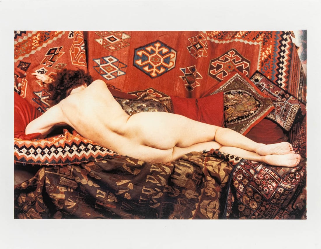 Anne Sager "Women Over 50" Chromogenic Print: Anne Sager (American, 1930-2024), Reclining Female Nude, Chromogenic Print in Colors, from the "Women Over 50" series, depicting a nude woman draped across carpets, artist's estate stamp verso, unfram